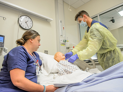 Two nursing students working together